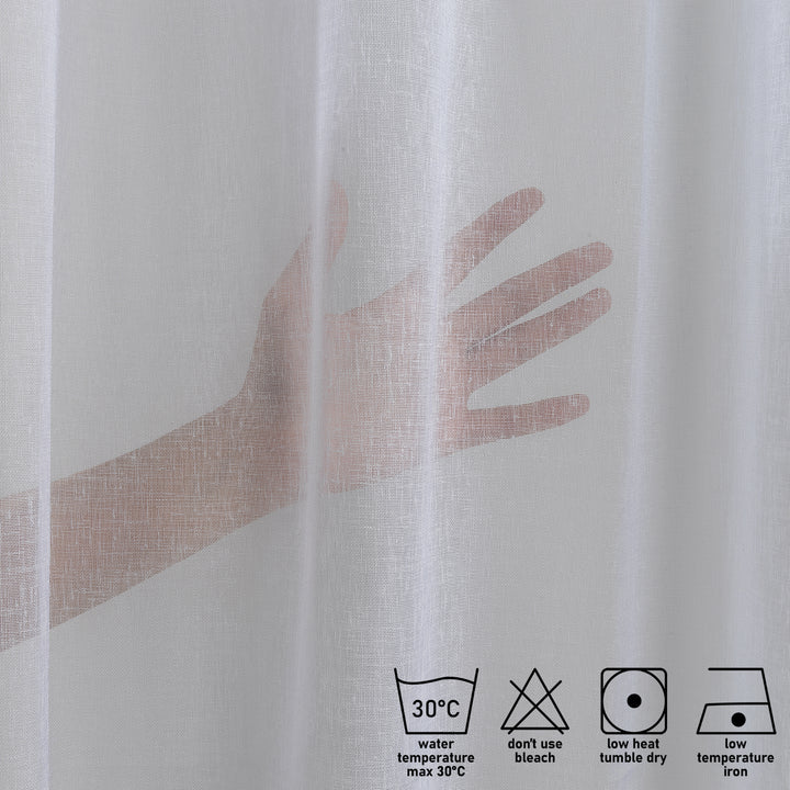 Fabric detail of white linen sheer curtain showing weave and care instructions.