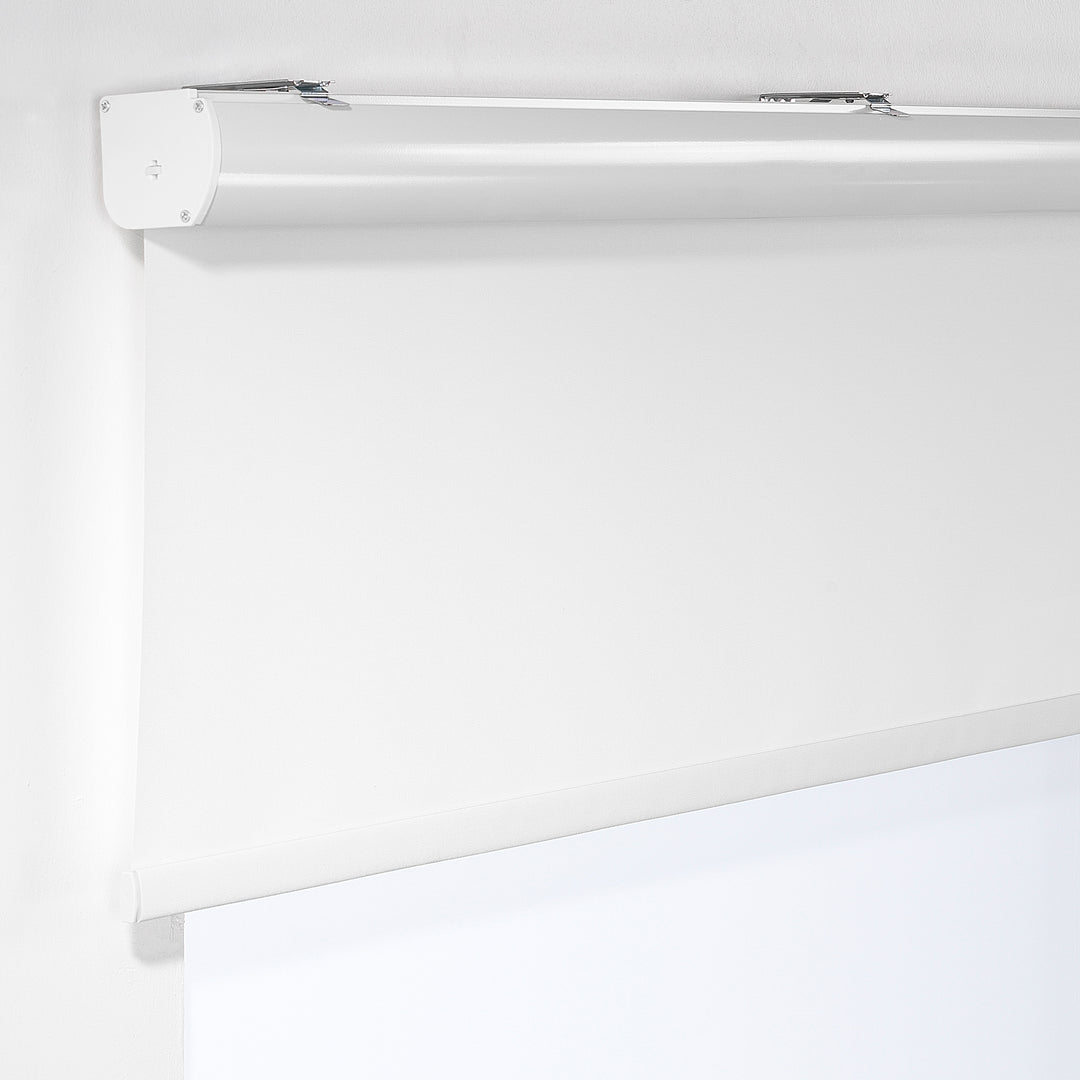 White blackout roller blind made to measure with maximum light blocking, smooth matte finish and premium custom fit ideal for bedrooms, privacy and full darkness control