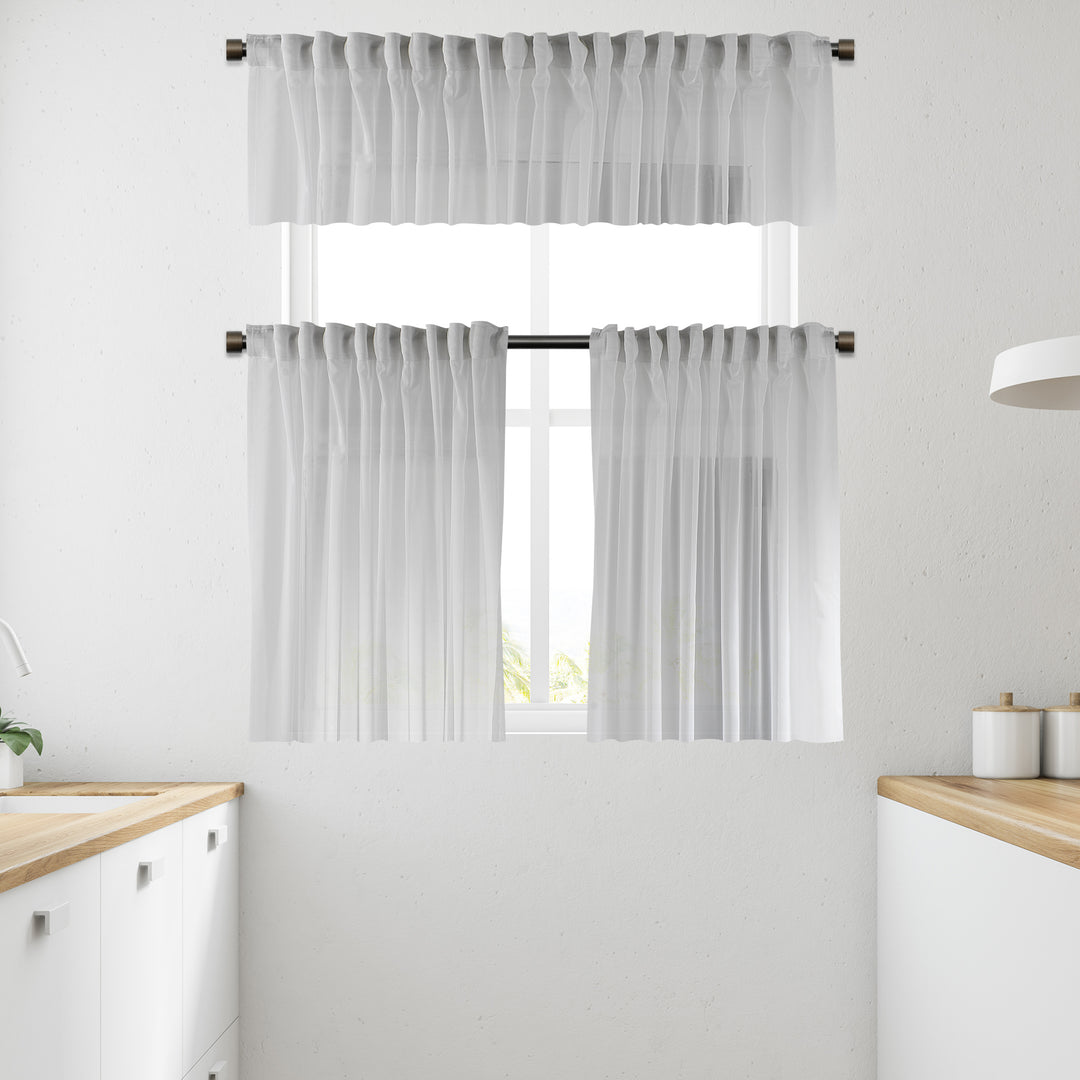 White sheer faux silk valance photographed in daylight, showing crisp translucency and smooth, lightweight drape.
