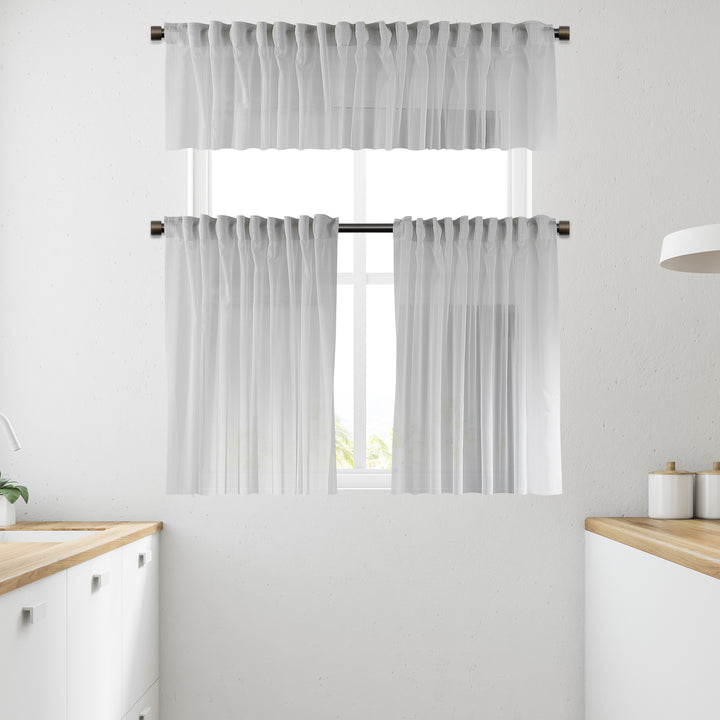 White sheer faux silk valance photographed in daylight, showing crisp translucency and smooth, lightweight drape.