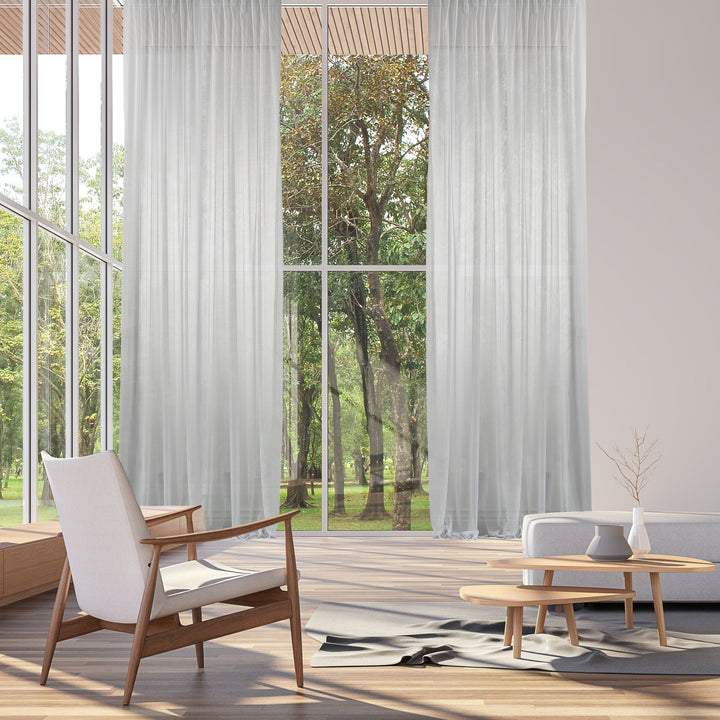 Extra‑wide extra long made‑to‑measure White sheer silk‑crepe curtain featuring a lightweight airy drape and softly diffused daylight.