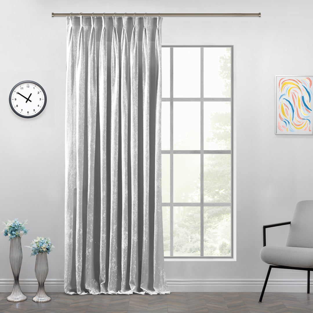 White shiny velvet pinch pleat curtain panel with structured pleats and a refined full‑length silhouette