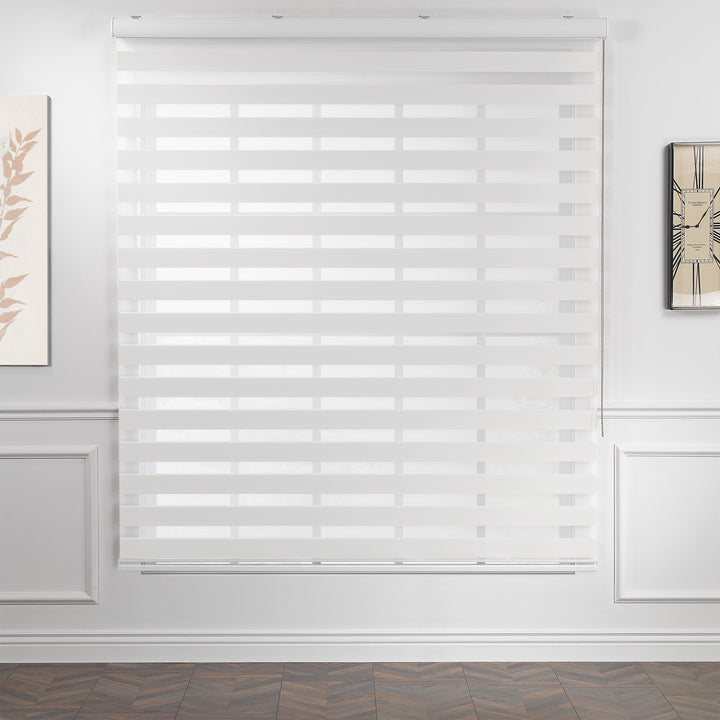 Made to measure solid plain white zebra roller blind featuring clean alternating sheer and dim‑out stripes for bright, adjustable light control and privacy, showcasing its crisp white tone, smooth texture and modern day‑and‑night blind design.
