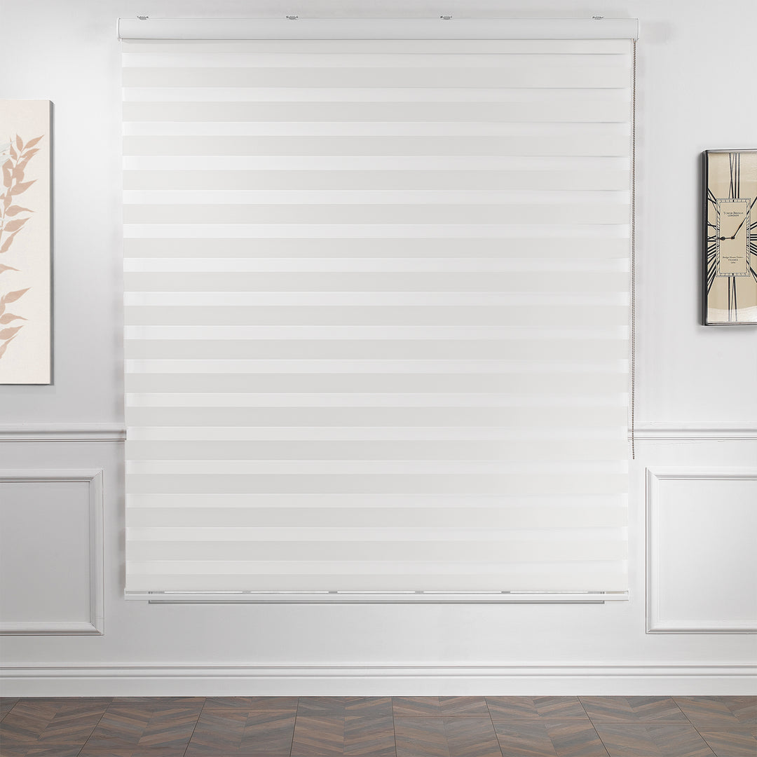Made to measure solid plain white zebra roller blind featuring clean alternating sheer and dim‑out stripes for bright, adjustable light control and privacy, showcasing its crisp white tone, smooth texture and modern day‑and‑night blind design.