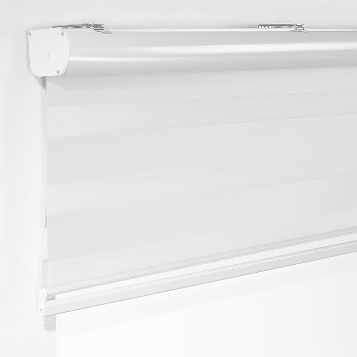 Made to measure solid plain white zebra roller blind featuring clean alternating sheer and dim‑out stripes for bright, adjustable light control and privacy, showcasing its crisp white tone, smooth texture and modern day‑and‑night blind design.