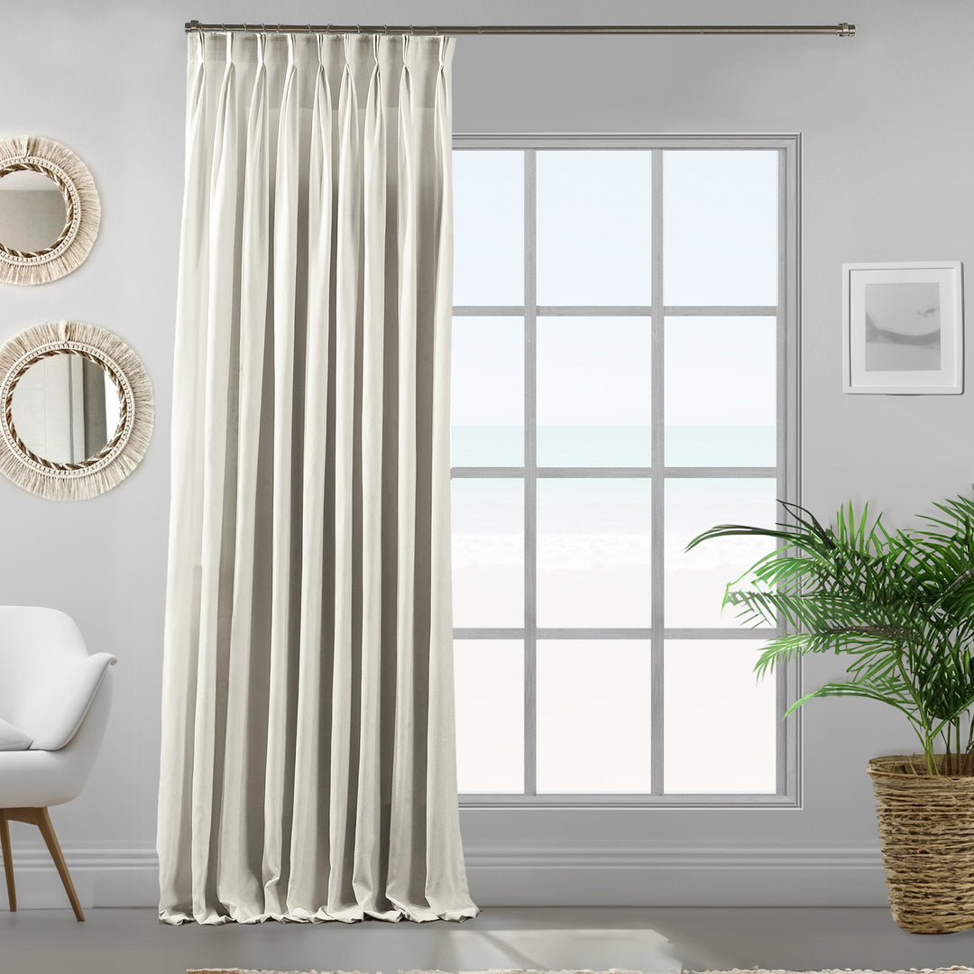Pinch pleated white velour curtain panel showing soft drape, dense pile and premium matte texture, made to measure and available by the metre.