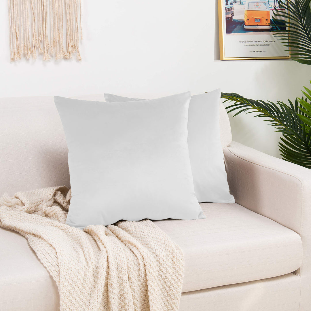 A made to measure cushion cover in classic white shiny velvet, shown with a smooth reflective sheen and neatly tailored edges for a clean premium finish