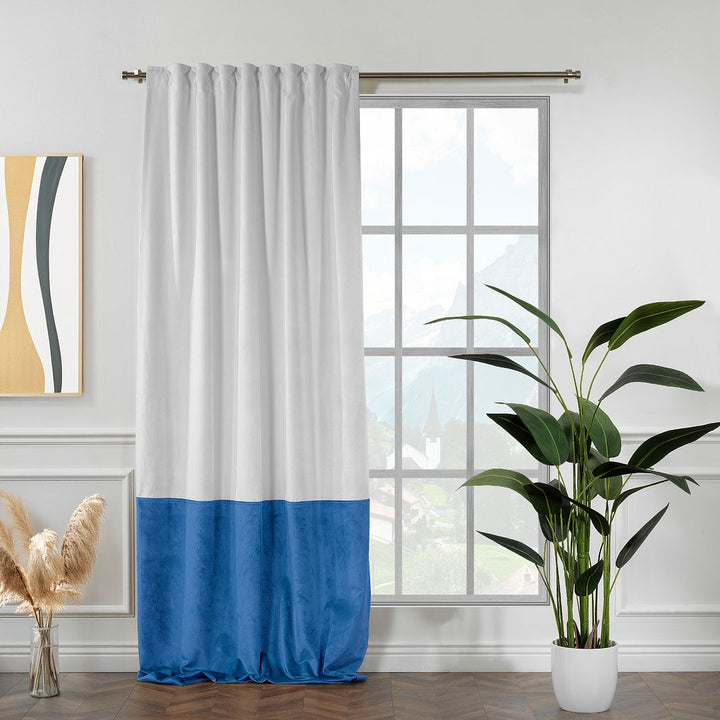 A made to measure matte velvet block curtain in white and blue, shown with soft drape, smooth pleats and a clean two‑tone finish