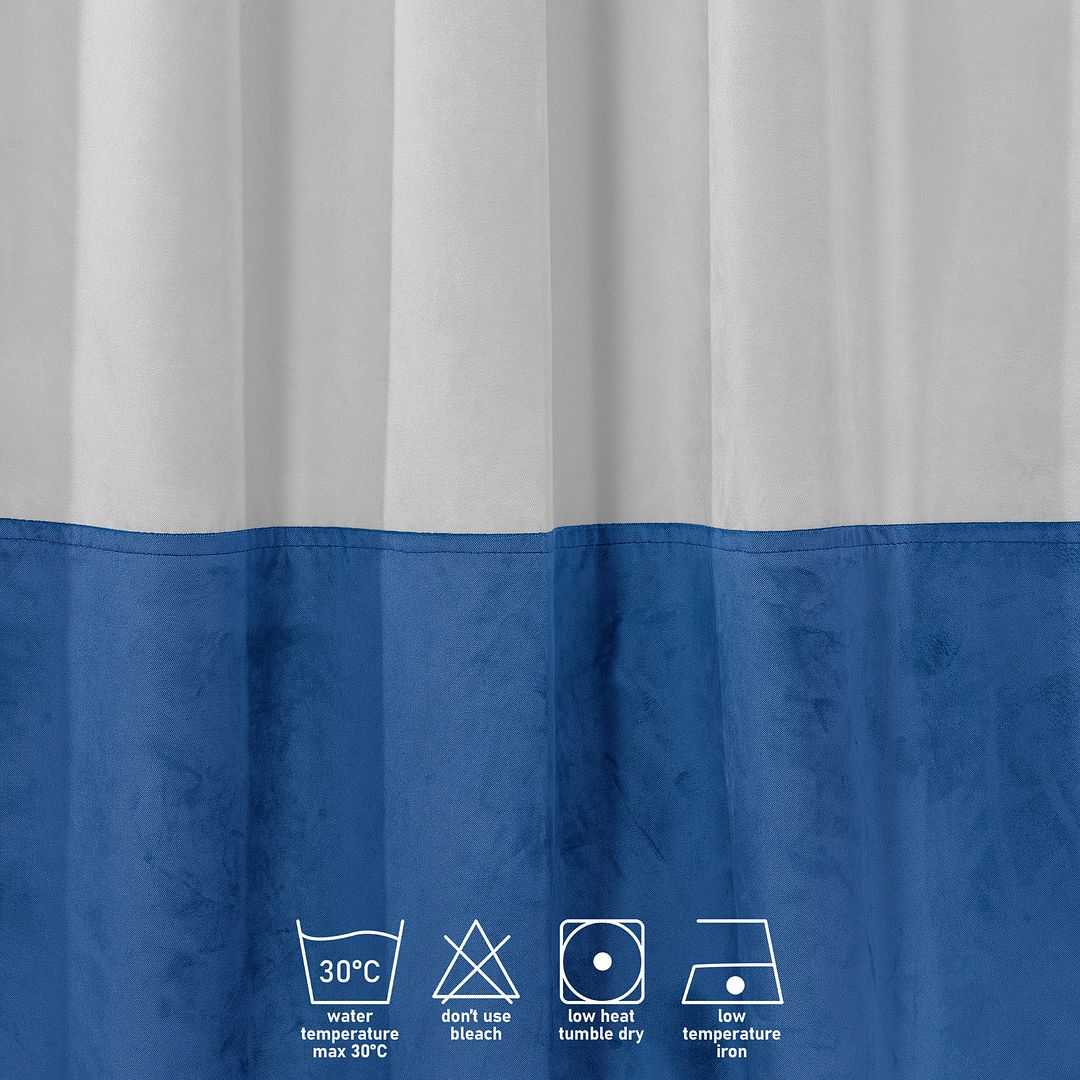 A close‑up of a white and blue matte velvet block curtain, displaying the soft texture and refined colour contrast
