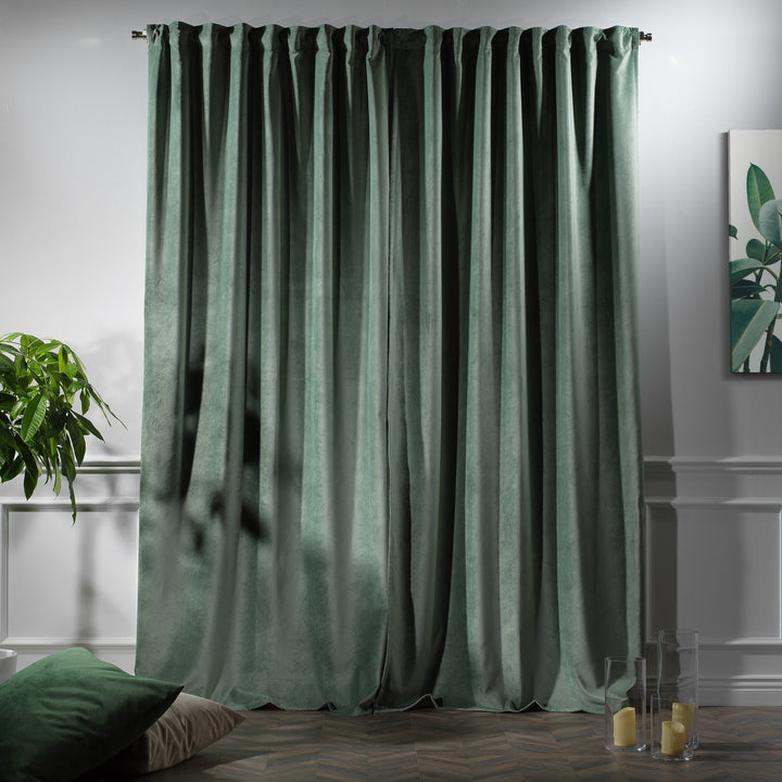 Matte velvet curtain with handcrafted pinch pleats and a long, flowing silhouette.
