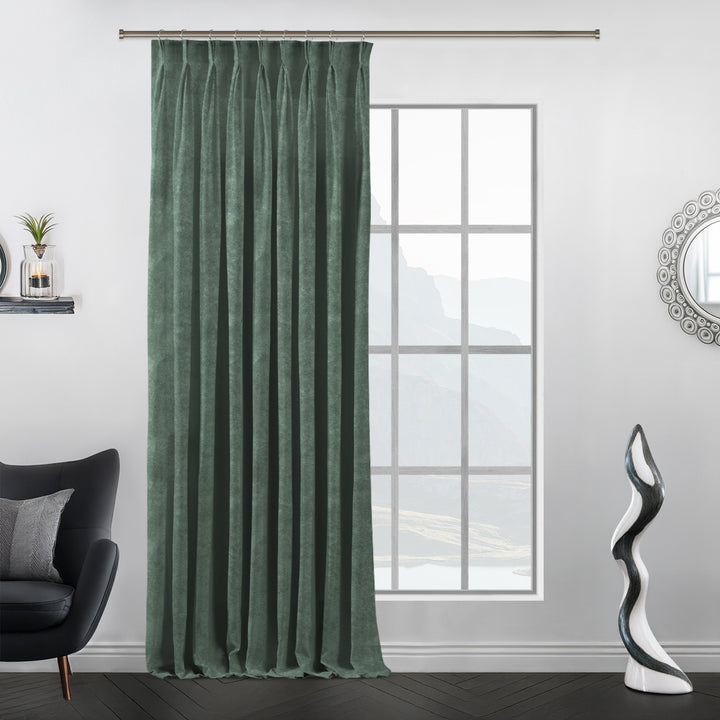 Matte velvet curtain with handcrafted pinch pleats and a long, flowing silhouette.