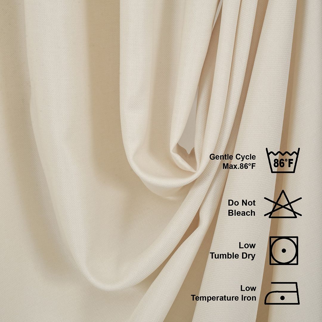 Beige fabric with laundry care labels on a beige background