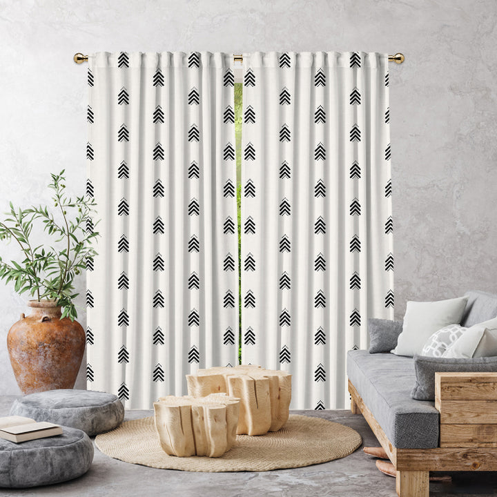 Curtains with black arrow pattern in a living room UK